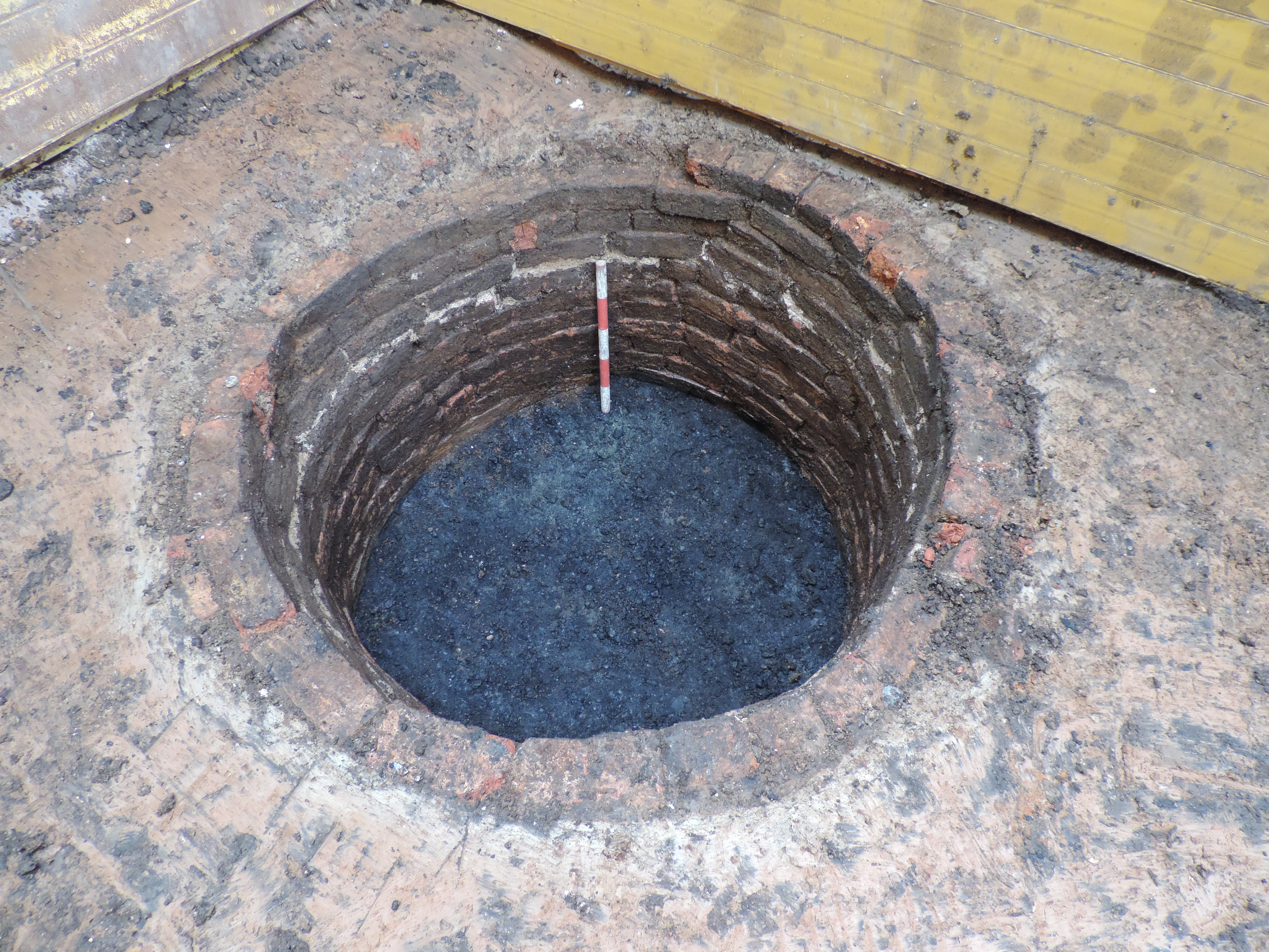 Brick-lined cesspit on an archaeological site Brick-lined cesspit on an archaeological site