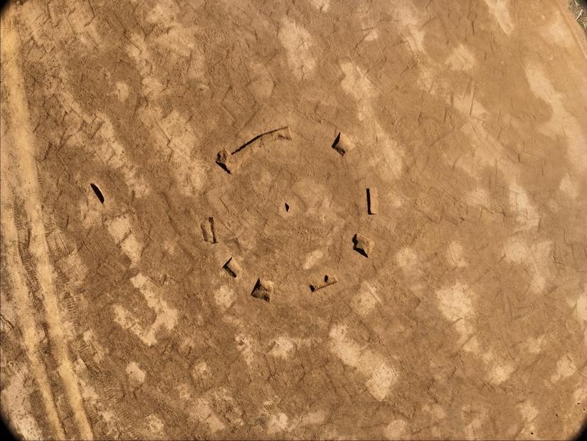 An excavated field with a circular shape in the centre