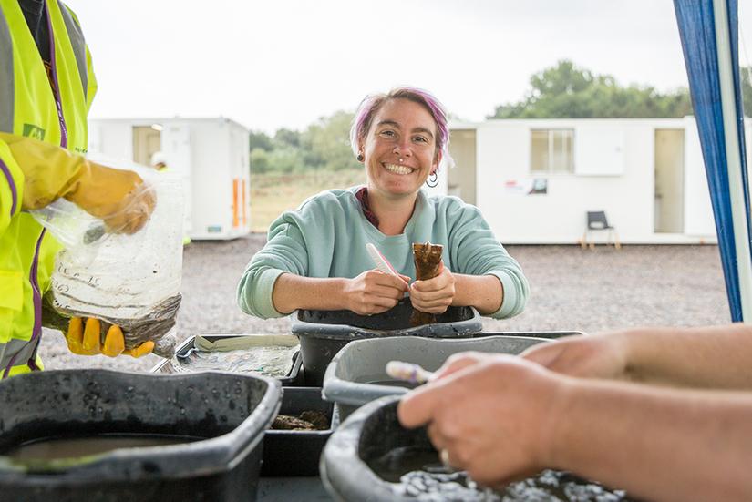 Finds processor Tee cleaning some finds in a gazebo