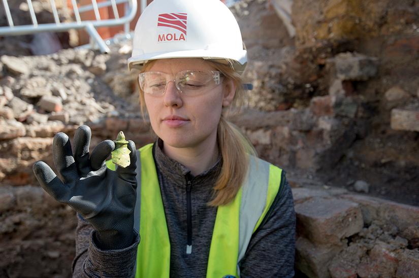 Archaeologist holding a find