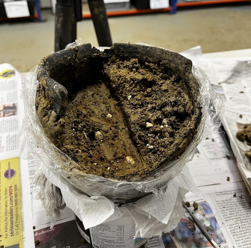 A pot with a layer of soil removed