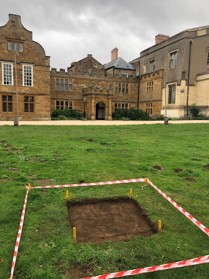 Photo of the square test pit with the turf removed