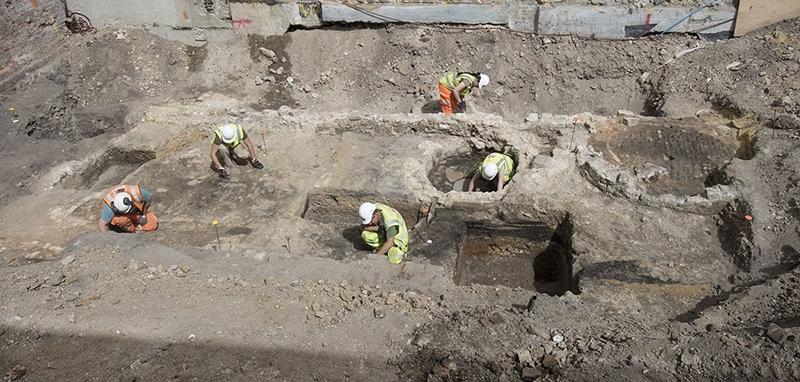 A group of archaeologists excavating