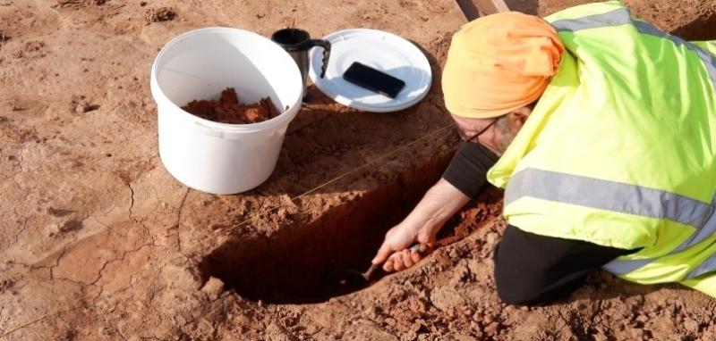 Archaeologist taking a soil sample