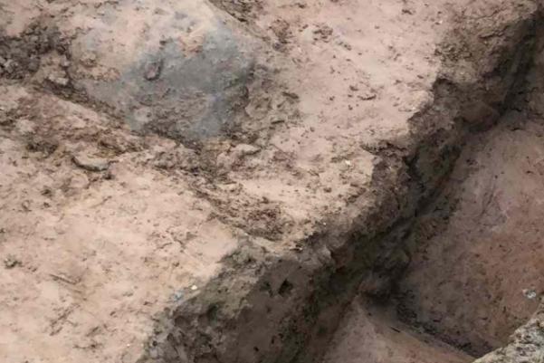 A trench with a old stream channel running through it