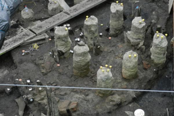An aerial photo of the excavated bread oven which is circular and has 8 small stone pillars