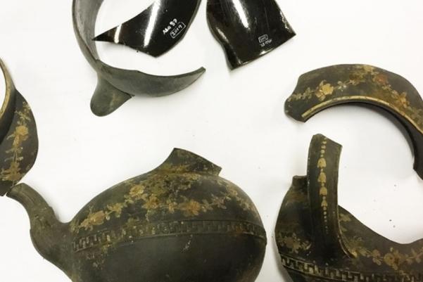 Pieces of dark coloured pottery