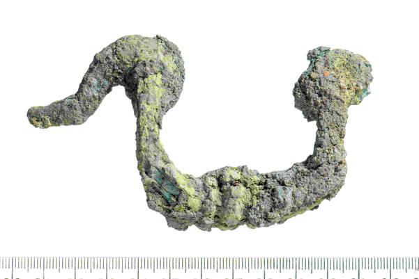 A grey-green coloured metal handle