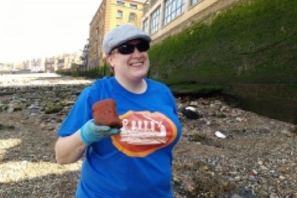 Photo of a volunteer showing us what they've found