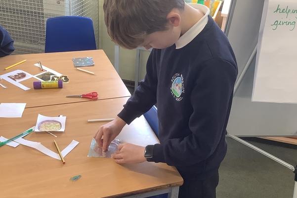 A child standing by a table