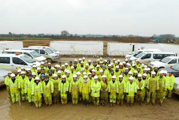 A group photographs of archaeologists standing in a large group