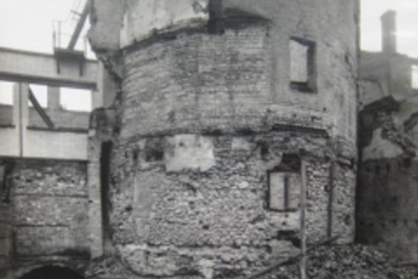 Black and white photo of bastion with modern walls on top of the original