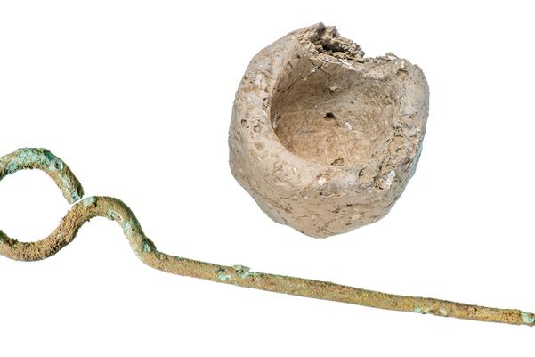 Iron age roundheaded pin and miniature vessel
