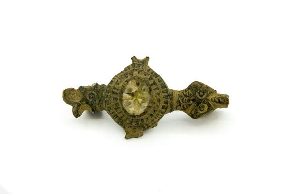 Continental Roman copper-alloy plate brooch with enamelled decoration and animal head terminals, 2nd century