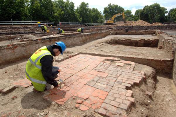 An archaeologist surveying the remains of the building