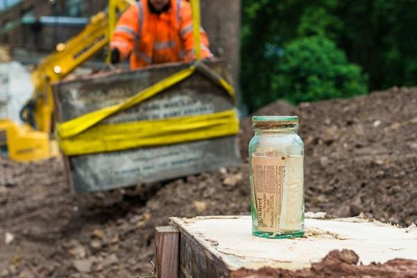 A glass bottle with papers inside