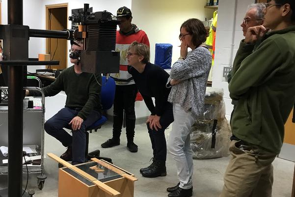 participants looking at photographs of pottery