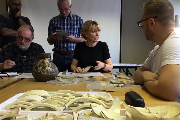 participants learning about pottery