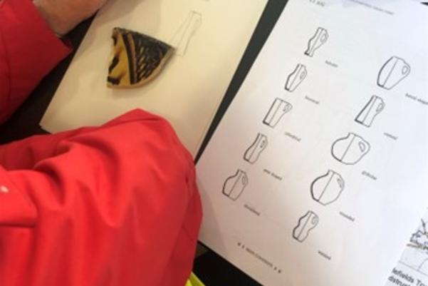 participant sketching a piece of medieval pottery