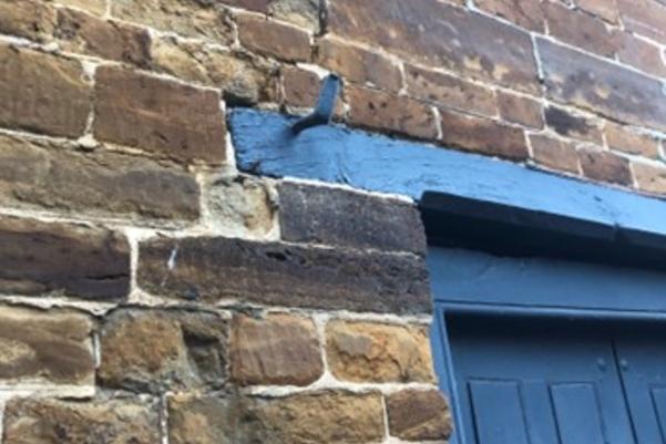 metal hook above a door