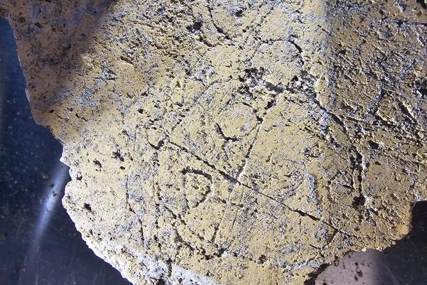 The fragment with graffiti of a crying face