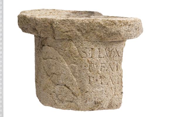 Base of a Roman column with writing carved into it.