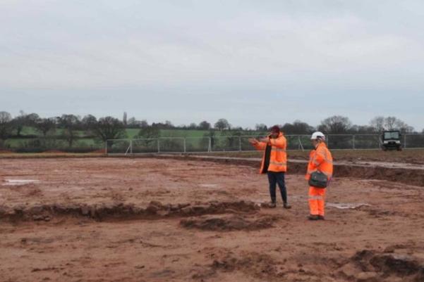 Archaeologists surveying the line of rubble wall
