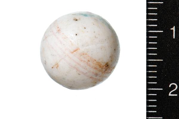 white alley with faint brown line around the centre