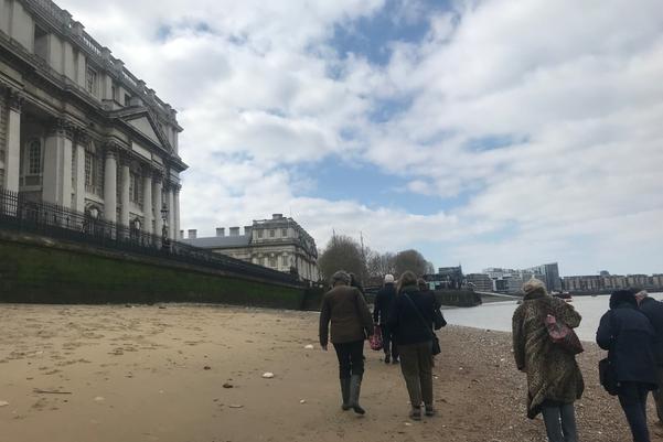 A group of people walking on the foreshore