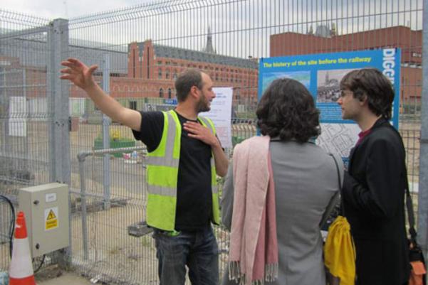 Archaeologist speaking to visitors about the site