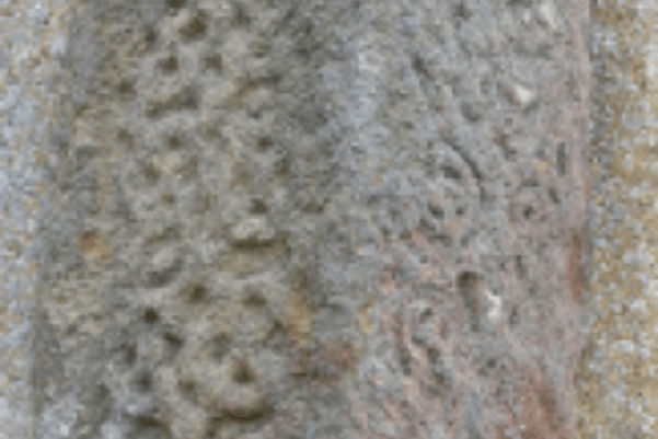 Photo of Anglo-Saxon stone carved with swirls and knot patterns