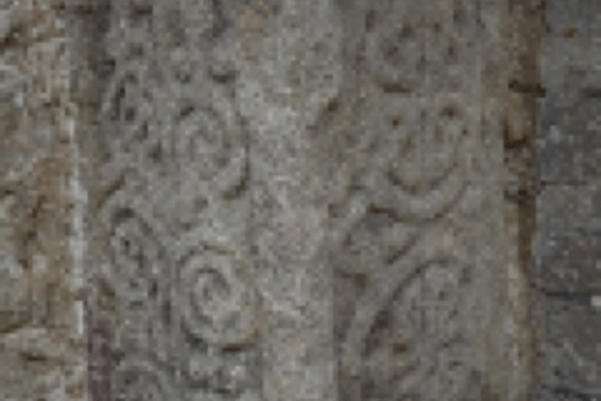 Photo of Anglo-Saxon stone discovered during the project carved with swirls and knot patterns