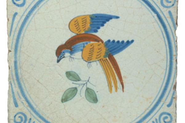 Photo of white tile with a bird design